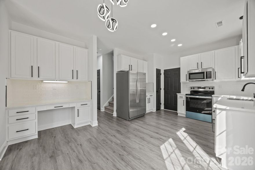 Meticulously remodeled home where no detail has been overlooked! Nestled on a private cul-de-sac lot in a desirable community, this property is just a short walk to one of the lakes, offering both tranquility and convenience.

Step inside to discover a modern, fully updated kitchen featuring new cabinetry, sleek quartz countertops, and stylish finishes throughout. The main level and all bathrooms boast durable and elegant LVP flooring, complemented by beautiful, updated light fixtures that enhance the home’s contemporary feel.

Enjoy outdoor living on the oversized concrete patio that spans the full width of the home—perfect for entertaining or relaxing in your private backyard. Additional highlights include a spacious concrete parking area along with a two-car garage, providing ample room for vehicles and guests.

This move-in-ready home combines thoughtful upgrades, functional space, and an ideal location. Exceptional value for this area— Just a great opportunity.