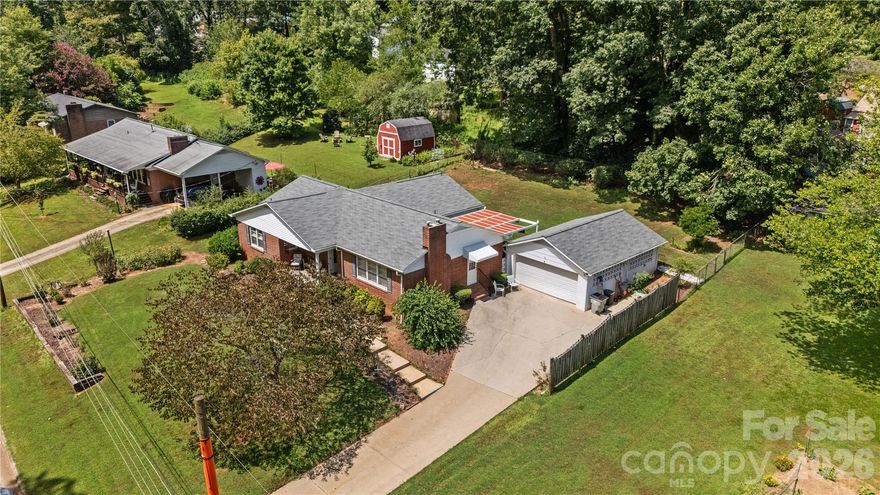 This beautifully maintained one-level 3-bedroom, 2-bathroom home offers more than meets the eye! Inside, you'll find gleaming hardwood floors, elegant crown and chair molding, and built-in cabinets throughout. The bright family room is filled with natural light, while the cozy living room features a charming gas log fireplace—perfect for relaxing evenings. Enjoy meals in the official dining room or sunny breakfast nook. Extra storage closets provide added convenience. Outside, unwind on the welcoming front porch or peaceful back patio overlooking the fully fenced back yard with mature, beautiful landscaping. A detached garage adds additional storage and flexibility. With its thoughtful layout, timeless finishes, and undeniable charm, this home is ready to be loved for years to come.