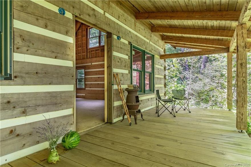 REDUCED AGAIN! cozy rustic LOG HOME in the FOREST PRIMEVAL! Peaceful, privacy and contentment away from the crowds.  This is a Stonemill Log & Timber home which has been lovingly and professionally constructed by it's owner. The Belmont is a traditionally styled log home designed with efficiency in mind. The back exterior roofline is accenturated with two large dormers. A covered rocking chair front porch. The main level has an open, spacious feel with a cathedral ceiling over the  great room. The kitchen connects to the pantry/laundry area. Has a custom hand stacked stone fireplace with a temp-cast dual chamber woodburner stove. Upstairs has a Master bedroom with full bath with a loft/study or bonus room. MAKE this home your own by fininshing to suit your taste. Full basement 12" thick stacked, rebarred foundation.Permit for Septic tank. The property has mature trees and you can choose what will be removed to finish the home. Call Jann for more details on this home!