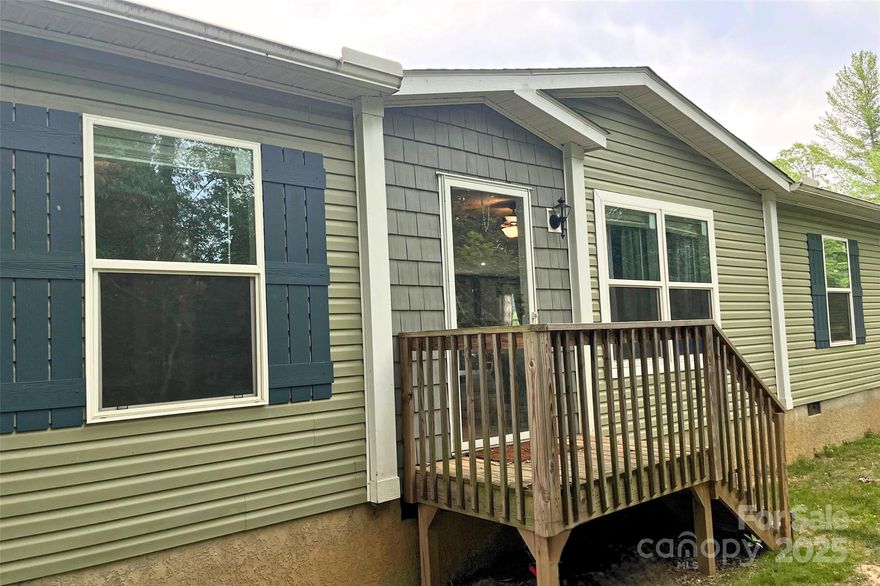 Perfect location on the Westside of Yancey County, just minutes to downtown Burnsville or short drive to Weaverville. With over 2.78 acres this home offers you potential, two living areas, a bonus room that could be an additional bedroom or office space, 4 bedrooms and 3 full baths. Enjoy the tranquility and wildlife outside your deck. Move in ready and new gravel just added to driveway.