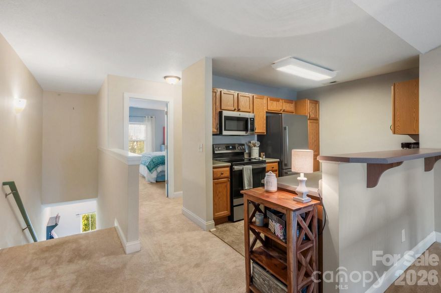 Bright and sunny with a split bedroom floorplan! This unit is MOVE IN ready with new carpet throughout and a well maintained interior. 

Tucked away in a quiet, private setting at the back of the community, this well-maintained condo offers the perfect blend of comfort, convenience, and lifestyle. Enjoy peaceful surroundings with no road noise, while still being just minutes from both Asheville and Hendersonville.

 The living space flows seamlessly to a private deck where you can relax and take in the serene view—an ideal spot for morning coffee or unwinding at the end of the day.

The community offers desirable amenities including a pool, clubhouse, and playground, all just steps from your door. Located near Fletcher Elementary, FernLeaf Community Charter School, and Fletcher Community Park, this home is perfectly positioned for both convenience and recreation.

With no rental cap, this property also presents an excellent opportunity for investors or those seeking flexibility for future use.