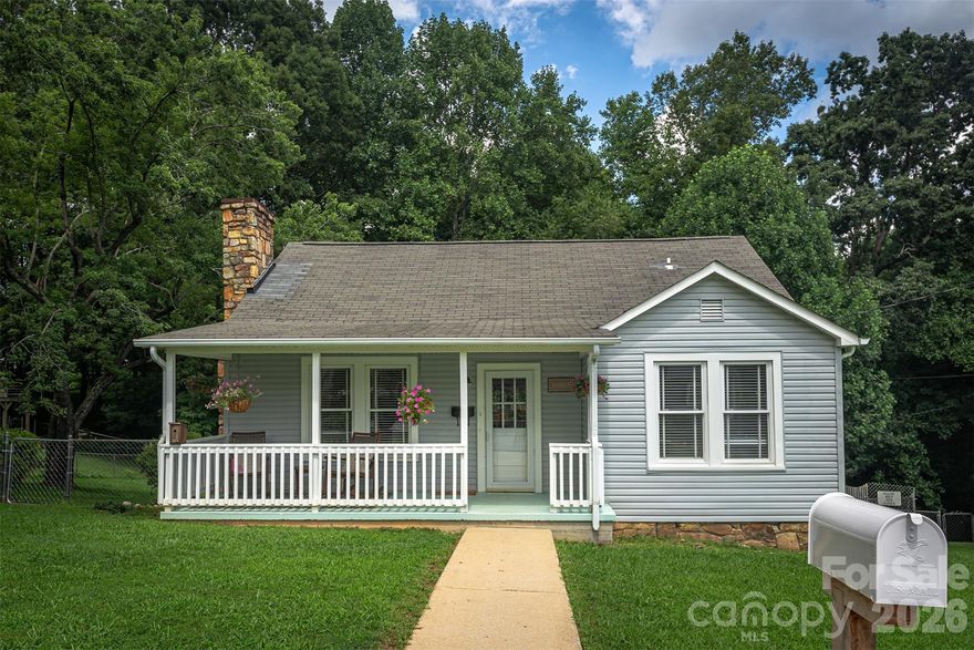 Welcome home to this bright and sunny bungalow with charm to spare! Quick stroll to Main Street with all of Marion's shops, restaurants, festivals and nightlife. The main level features 2 bedrooms and a full bath. Beautifully updated spacious kitchen with handmade custom cabinets. Adjoining dining area with sliding doors to the back deck. Upper level offers 1 bedroom and 2 bonus rooms (upper level 295 sq ft is not included in square footage due to ceiling height). Beautiful oak and maple hardwoods on the main level. Big fenced yard! Great outdoor space with both front and back porches. Quiet, well established neighborhood. Come enjoy the small town charm while being less than 40 minutes from Asheville. Lovely mountain view from the front porch. Come see this beautiful home today! Agent owned.