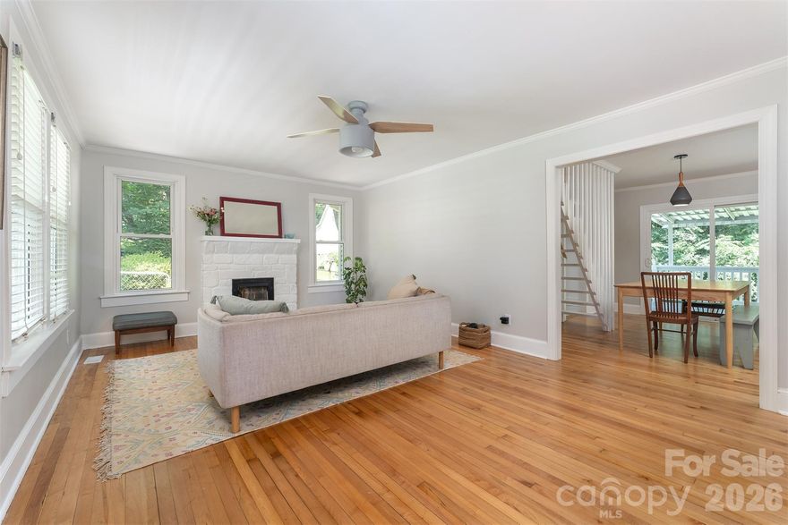 Welcome home to this bright and sunny bungalow with charm to spare! Quick stroll to Main Street with all of Marion's shops, restaurants, festivals and nightlife. The main level features 2 bedrooms and a full bath. Beautifully updated spacious kitchen with handmade custom cabinets. Adjoining dining area with sliding doors to the back deck. Upper level offers 1 bedroom and 2 bonus rooms (upper level 295 sq ft is not included in square footage due to ceiling height). Beautiful oak and maple hardwoods on the main level. Big fenced yard! Great outdoor space with both front and back porches. Quiet, well established neighborhood. Come enjoy the small town charm while being less than 40 minutes from Asheville. Lovely mountain view from the front porch. Come see this beautiful home today! Agent owned.