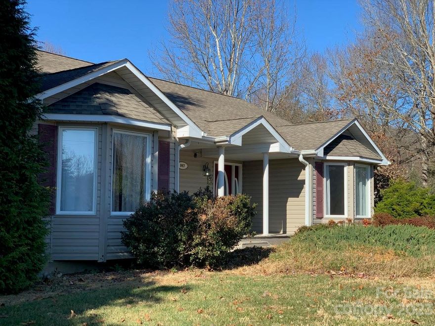 Main level has 3 bedrooms and 2 baths with hardwood flooring except in bedrooms. The large kitchen has a  breakfast nook. The backside of the main level has a large deck. The attached 2-car garage with paved driveway is on the main level. From the front porch, master bedroom and kitchen there is a gorgeous view of the mountains. The lower level has a 1 bedroom 1 bath in-law apartment plus 4 additional bonus rooms (2 with closets) and a second bathroom. There is a concrete driveway leading to the lower-level apartment with room for 4 parking spaces. This home can be used as single family or rent the downstairs in-law suite and still have plenty of storage in the 4 extra bonus rooms. This property can also be purchased with the nearby, four-plex property (with 3 leased) ($675,000) to create an easily managed real estate investment portfolio.