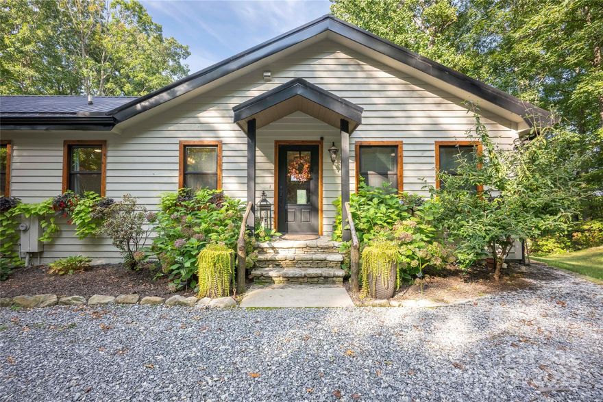 Perched on six private acres along the Nantahala National Forest, this mountain retreat offers unmatched serenity, luxury, and sweeping year-round views. Just minutes from the storied Greystone Inn and the historic Grand Olde Station Restaurant, it’s ideally situated for indulging in the area’s finest hospitality and dining — before returning home to your own private sanctuary. The home blends modern finishes with timeless mountain character. A chef’s kitchen with high-end appliances and a custom island anchors the open layout, flowing into a light-filled lower level framed by endless mountain vistas — perfect for entertaining or quiet evenings by the fire. The primary suite is a retreat unto itself, featuring a private sitting area, spa-inspired bath, and dual oversized walk-in closets. Thoughtful upgrades and smart storage throughout elevate everyday living. With adjacent trail access into the protected Nantahala National Forest, this is mountain living at its finest — whether it’s sunrise coffee, sunset wine, or starlit gatherings with friends. This isn’t just a home — it’s a destination. And the views? Simply unforgettable.