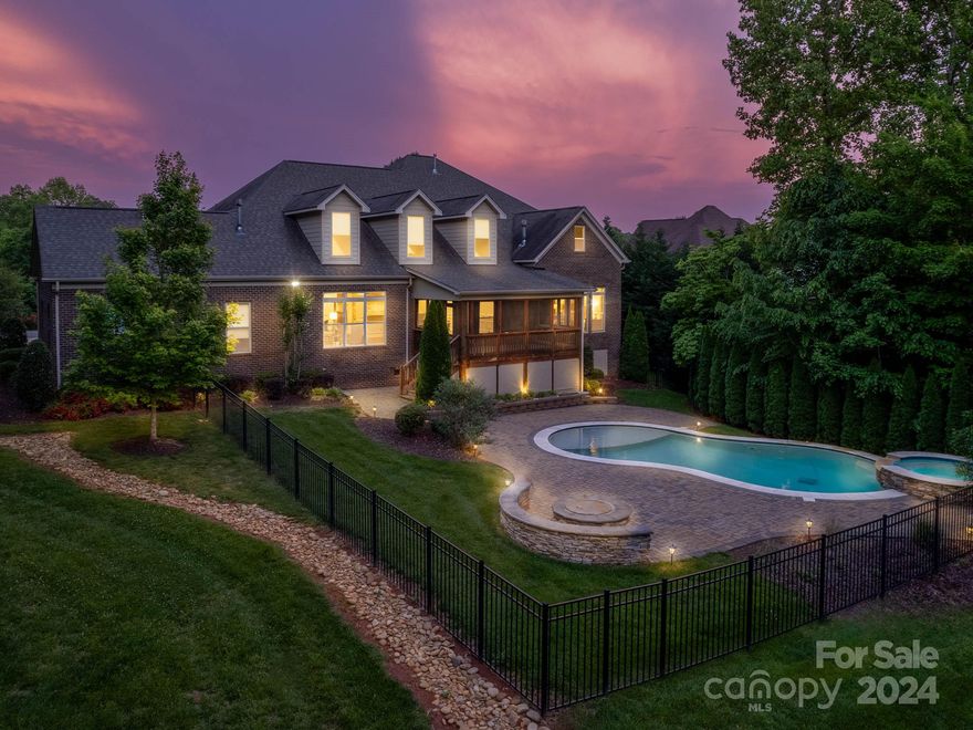 Lounge in the secluded backyard oasis, boasting a saltwater pool and inviting hot tub embraced by lush greenery, ensuring your privacy. Inside, relish the expansive layout, ideal for hosting gatherings. The well-equipped kitchen caters to culinary enthusiasts, offering ample space and premium appliances. Step onto the screened-in porch and unwind in its serene ambiance. Retreat to the primary suite, featuring a tranquil pool view and a spacious closet for added convenience. Upstairs, discover four bedrooms, each with its own ensuite or access to a shared jack-and-jill bath, providing personal space. A generous bonus room adds versatility to the home. For car aficionados, the property includes a spacious 5-car garage, providing ample room for vehicles and storage. Don't miss this exceptional opportunity to make this stunning property your own.