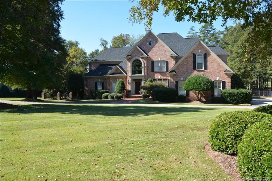 Exceptional full brick custom home overlooks the 4th fairway of Fort Mill Golf Course!!
many upgraded features.....custom kitchen cabinets, 2-story FP with built-ins in sunken great room, decorative mouldings, high ceilings are just some of the exquisite features.  The open floorplan makes for easy entertaining as does the professionally landscaped yard with rear covered porch, patio, in-ground pool and firepit.  The beautiful HW floors have just been refinished and new carpeting installed too.