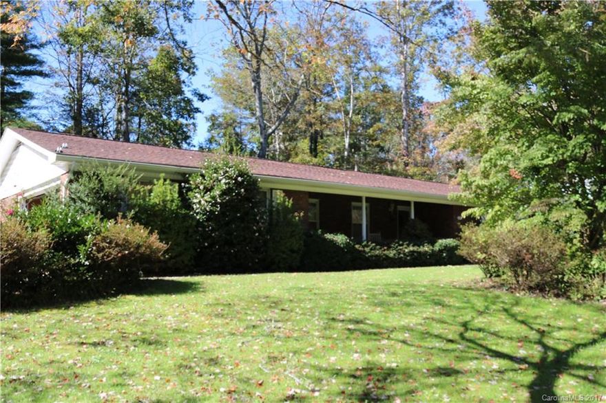 Discover this handsome home conveniently located within walking distance to Etowah Valley Golf CC.  Features include desirable brick exterior, spacious rooms throughout, delightful den with cozy fireplace off kitchen, beautifully rolling parcel and much more.