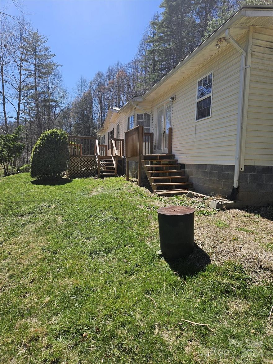 Motivated seller! Beautiful setting for this home surrounded by rolling meadows and a nice view of the mountains off in the distance. Outdoor space includes a small pole barn/shed for outdoor equipment, hobbies or whatever you desire to make of it. Nice front deck will become your favorite spot to hang out and soak in the view. Wood burning fireplace in living room  provides ambiance and extra warmth on those chilly winter days. Imagine sitting by the fire and watching the snow fall out the windows with the beautiful Blue Ridge Mountains in the distance. Great starter home, retirement home, STR or anything in between. 

Approximately 520 square feet of additional square footage is not permitted.