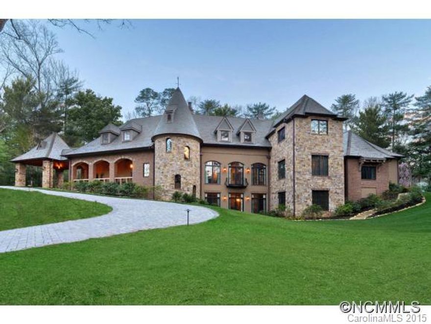 Magnificent 3-story Old World Normandy-style home designed by Griffin Architects on secluded knoll near Biltmore Estate. Built in 2010 to highest standards in architecture, technology & comfort w/ space & intelligence that cater to 21st C. needs. Generous main floor w/terrace lives & entertains w/ ease; expand to lower & upper floors for recreation & guests. Close to membership Country Club. In-town convenience! MUST SEE LIST OF DETAILS/FEATURES