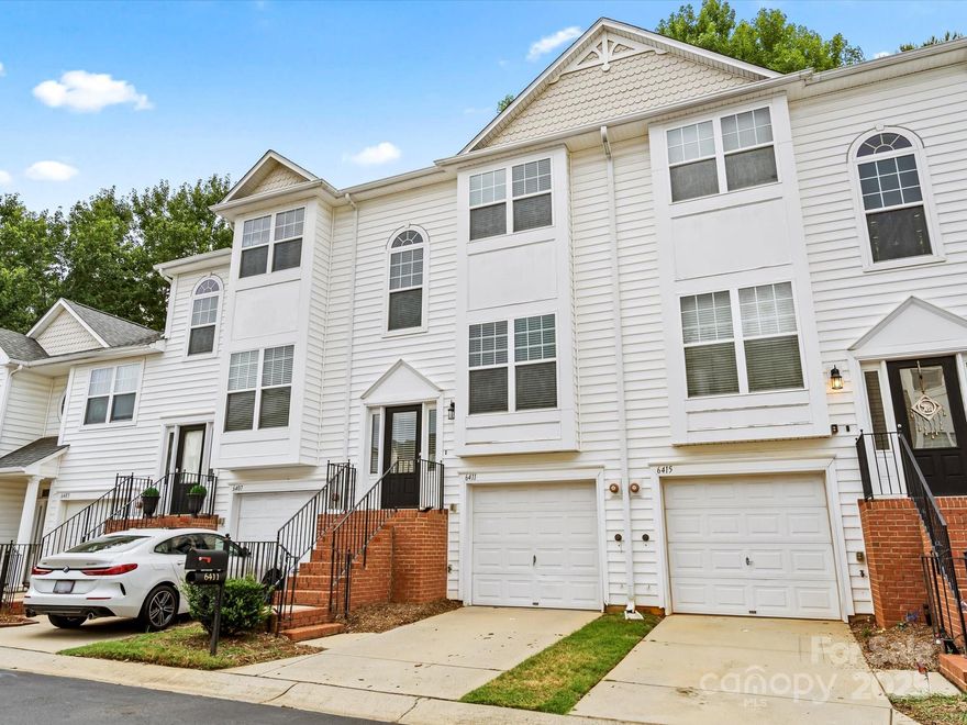 MOVE IN READY! Welcome home to this lovely 3-story townhome in Avalon at Mallard Creek, a gated community in Charlotte, NC! Freshly painted throughout, this spacious 2-bedroom, 2.5-bath unit with 1-car garage features an open living area with a fireplace and built ins, an adjoining balcony/terrace/sundeck, a dining area with an elevated countertop for barstool seating on the main level! Both of the spacious bedrooms are on the upper level offering privacy and solace from the rest of the home. The lower level offers the laundry area, garage access, plus a den/flex/recreational space with french doors leading to a back covered patio! Plenty of closet space on each level for storage! This townhome has access to fantastic community amenities including a clubhouse and pool. Enjoy the convenience of being close to major highways, shopping, dining, and top local attractions. Ready and waiting for you!