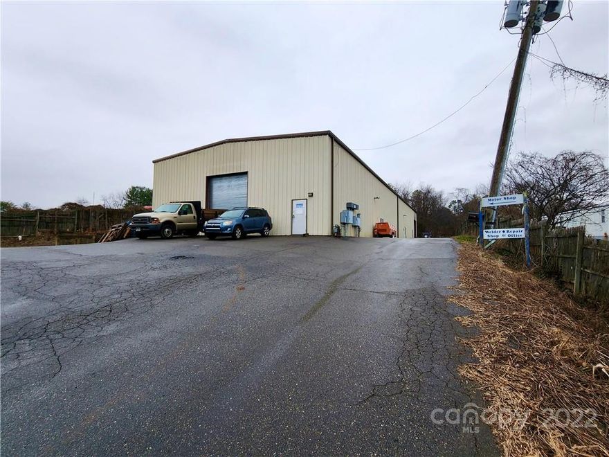 This unique property sits on 1.22 acres and offers an 8000 sqft warehouse/office space, located near established Westside Commercial park. Easily accessible. 2 units in building -divided by a firewall and a fire rated walk through door. 400 sqft of office space, 1 full & 2 half baths, building engineered w/5 ton monorail beam in the center of the ceiling  (used regularly) 10 ton bridge crane supports every 20ft, both run entire length of building, w/bridge crane rails installed on first 100 ft, includes 3 12x14 galvanized roll up doors, 1-8x8 roll up door w/loading dock, city water & septic tank, both warehouse sections have natural gas heat, offices share one central ac unit & electric heat, both units have separate power & gas meters, potential for owner financing with a 35-40% down payment and 7% interest rate.