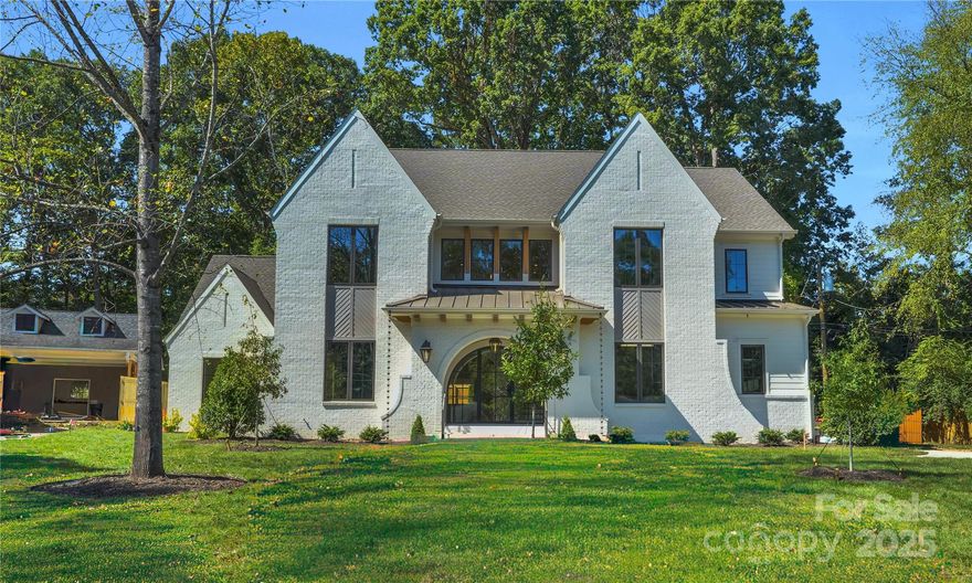 3030 Brookridge Lane is a stunning blend of elegance and functionality—complete w/ Pool, Spa & Firepite. Flooded with natural light, the open layout welcomes you w/ a soaring two-story foyer and elegant arched openings that guide you into the heart of the home. A main-level guest suite with full bath, dedicated office, and vaulted rec room complete w/ wet bar & doors that take you to your poolside retreat making entertaining effortless. The kitchen features 48" range, panel ready fridge/freezer while the scullery comes w/ a 24" wine fridge & ice maker. A separate pantry provides ample storage.  Upstairs, the primary suite is a true retreat w/a stained wood ceiling detail, walk-in close w/ islandt & the vaulted ceiling en-suite bath that is truly breathtaking. 3 secondary bedrooms & a versatile bonus room offer comfort and flexibility. Every detail of this home has been intentionally designed for high style and livability in one of Charlotte’s most desirable locations.