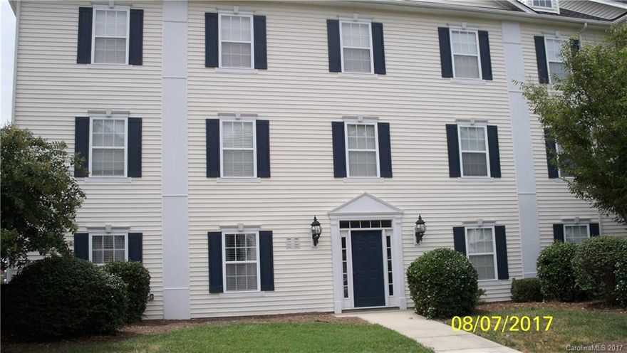 Second floor condo with updated lighting, flooring, and blinds. Sprinkler system in the building and fire warning system.  Located in the heart of Harrisburg with community pool, walking distance to fitness facilities, food and shopping.  This is a growing area with more business coming.  Great commute to Charlotte, Speedway and interstate highways.  Master bedroom has sitting area and large walk-in closet.