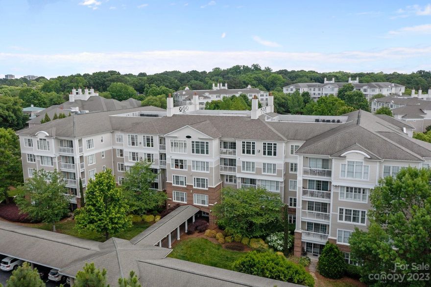Welcome home to The Cypress of Charlotte, a licensed Continuing Care Retirement Community.  This gated community, nestled on 65 acres in the heart of South Park, is country-club inspired living at its best. Villa E-412 is the highly sought after Osprey floor plan. Upon entering the fourth floor villa, you're welcomed into the large light-filled living room complete with built-in bookshelves and fireplace.  A formal dining area and wet bar adjoin. 2 large primary suites in a split-plan design each boast their own generous bathroom and walk-in closet.  The cozy den overlooking the balcony is the perfect place to curl up with a good book.  The kitchen is all white and includes a desk nook and an enormous walk-in pantry/laundry room with a second refrigerator. This home has been immaculately maintained and your membership includes access to world-class amenities. Please visit www.thecypressofcharlotte.com for an overview of this beautiful Life Plan community. Now showing for BACK UP OFFERS
