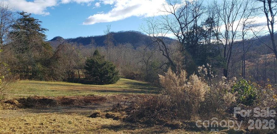 Welcome Home to the Countryside in Union Mills, NC. 512 Hemphill Rd. is a rare find with a broad stream at the back of the property, as well as wooded boarders to the sides for privacy from neighboring properties. Schedule a tour today and come out to enjoy the rolling hills, with a private country setting offering Mountain views and a stroll to Tightenrun Creek (as named on Survey).  The creek boarders at the back lower end of the property. Offering 2.32 Acres of unrestricted property, with No POA - No Association or Dues. 512 Hemphill Rd ~ Foundation started for Parcel 1653580 ~ 2.32 Acres on Stone Creek /Tightenrun Creek per Survey. The Seller would also consider selling the existing Farmhouse to left at 524 Hemphill Rd.  Call the Listing agent for details. The Seller is a builder, was NJ licensed and has NC Licensed Contractors to work with Locally. You can work with the Seller to have the current home designs completed, per the Blueprints the Seller has in place; or you can bring your own builder and/or plans. The basement block and foundation slab has been started, so you can utilize and complete to your preference. The Septic & Well are not installed. The permit for septic/well and the original building permit has recently expired. Buyers' responsibility to have all permits reissued. Call Jean today to schedule a Tour!