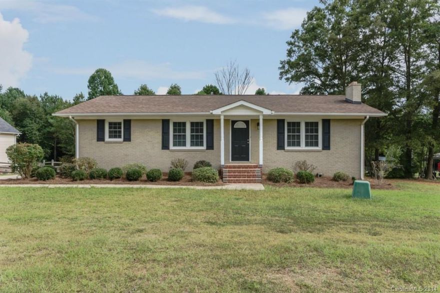 BEAUTIFULLY UPDATED Country Home with Acreage only 5 minutes from I-77, restaurants & shopping! Unwind from the hustle and bustle in this RANCH with Basement. Featuring new or nearly new:  roof, doors, windows, cabinetry, appliances, HVAC system, electrical & lighting, Bath, & more. Freshly painted inside and out! Laundry chute.  Lovely level lot with wooded back - over 5 acres! Spacious Basement with 1 car Garage and walk-out back access could be workshop.  Home Sweet Home!