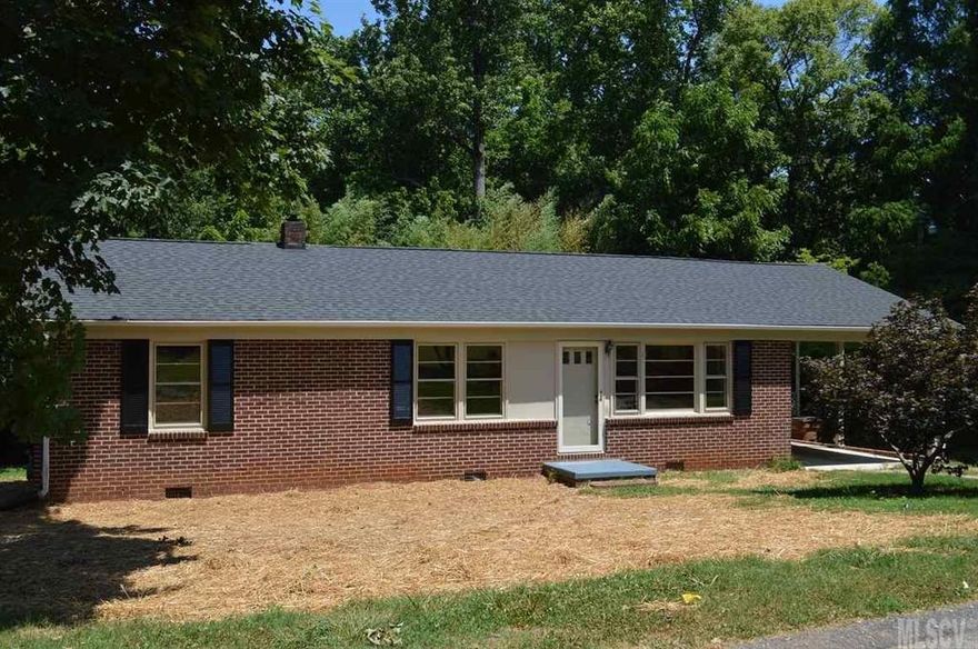 Cute brick ranch on quiet street, 3BR/1BA. The beautiful wood floors in living room and bedrooms have just been refinished. Freshly painted inside and out in neutral colors. Kitchen and dining room are spacious, as are the rest of the rooms in the house. Deck on back of house is covered. Large outbuilding could make a great workshop or just good storage. Cellar could provide additional storage. Creek flows across the back of the property. Great condition and a great value.