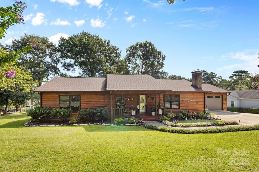 Welcome to this charming home in the highly sought after Moonlight Bay lake community. This well-maintained 3-bedroom, 2-bath, single-story home features numerous updates, including: new blinds throughout, newer dishwasher, new chimney cap for your wood-burning fireplace, encapsulated crawlspace with dehumidifier, French drain, leaf guards on gutters, custom insulated garage door, water filtration system, newer light fixtures in the kitchen and dining rooms, and beautifully updated bathrooms (2022). Enjoy lake views from the back deck or relax and watch the sunset from the front porch swing on your .47 acre lot. Also, NO HOA! Community amenities include lake access, a picnic area, and a small beach perfect for swimming and kayaking. Conveniently located approximately 2 miles from grocery stores, dining, shopping, boat launch, and medical facilities. Washer, dryer, and refrigerator to convey with acceptable offer.