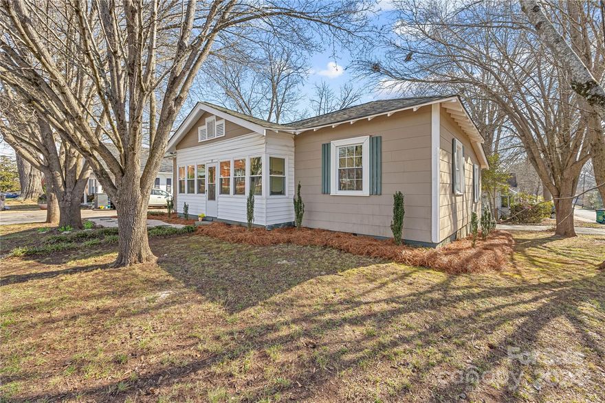 Cutest bungalow in Cramerton is ready for it new owner! Conveniently located within walking distance to Goat Island, restaurants, swimming pool and all Cramerton has to offer. Imagine sitting in the enclosed front porch, drinking your morning coffee as you watch all the joggers go by! Enter into an oversized living room with a fireplace for ambiance. The fireplace is for decor only. To the left is a spacious area for dining or office use connected to the kitchen with a new sink and dishwasher. This home offers two bedrooms with lots of closet space. One remodeled bathroom with a tiled shower, an enclosed back porch with room to exercise and a washer and dryer. This home has ample parking with two driveways and a huge garage/man cave just waiting for you! Some updates have been done and some left to keep the charm of this home. Close to Charlotte International Airport makes this an amazing location.
