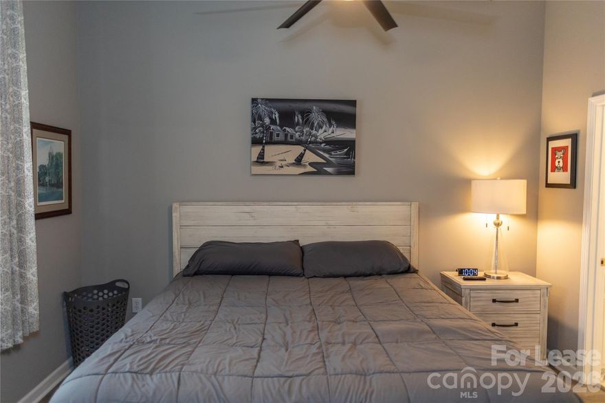 This elegant second-floor condo at 107B White Street offers a perfect blend of modern convenience and downtown charm. Featuring two bedrooms and two full bathrooms, this fully furnished rental provides a turnkey living solution in one of Morganton's most desirable locations.

Step inside to discover an open floor plan showcasing stylish LVP flooring throughout. The kitchen impresses with sleek granite countertops and stainless steel appliances that would make even amateur chefs nod in appreciation. High ceilings create an airy atmosphere, while ceiling fans ensure comfortable temperatures year-round.

The primary bedroom boasts a spacious walk-in closet, providing ample storage for your wardrobe collection. Modern fixtures and thoughtfully selected furnishings demonstrate the meticulous attention to detail throughout this residence. Your private porch offers the perfect setting for morning coffee or evening relaxation.

Convenience abounds with in-unit washer and dryer, plus elevator access to ease your comings and goings. Perhaps most appealing is the central location, placing you within walking distance to downtown Morganton's vibrant offerings.

Nature enthusiasts will appreciate Martha's Park just a short stroll away, while Food Matters Market And Cafe is practically at your doorstep—only 254 meters from home when your pantry needs replenishing or you crave a quick bite.

This refined property represents urban living at its finest, though we must note that pets are not permitted. Don't miss this opportunity to embrace sophisticated living in the heart of Morganton.