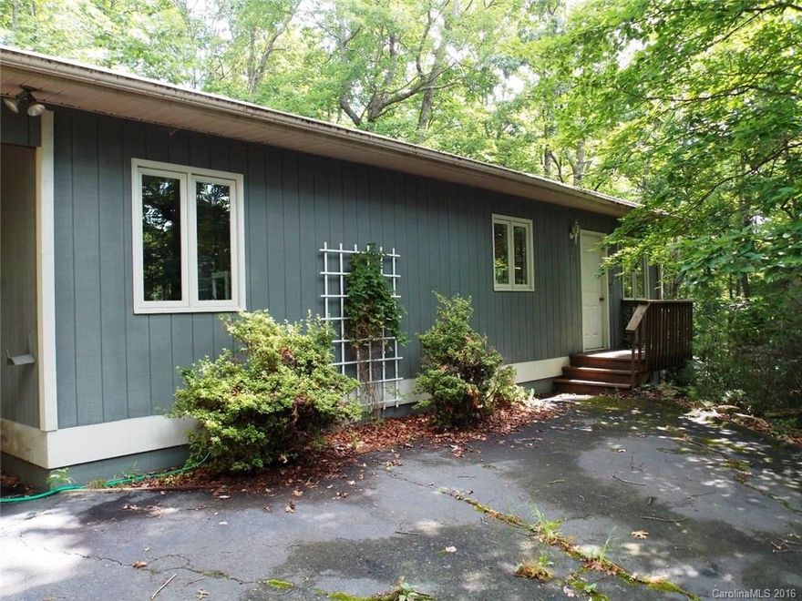 This 3BR 2BA home offers 1 level living & a wooded lot on a cul-de-sac street.  Enjoy a perfect weekend/summer getaway in a gated community with all the amenities: golf, swimming, boating, tennis, hiking trails, pickleball, fitness center & clubhouse.  Spacious  living & dining area.  Wood burning FP & a large deck for grilling. Possible rental investment property.  Close to Lake Atagahi, East Fork Gate & Clubhouse. Connestee Falls User Amenity Fee $8,000