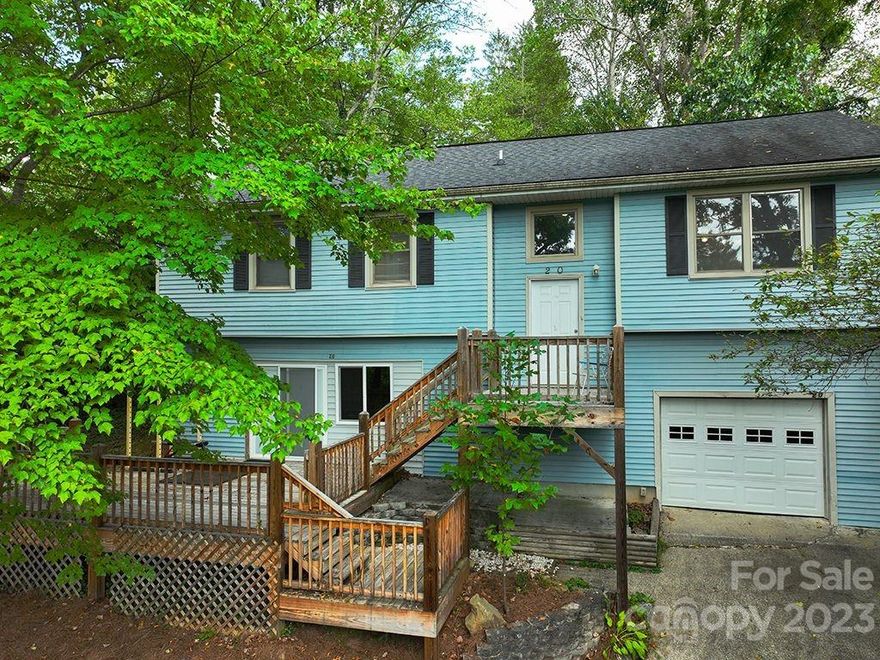 Discover the timeless charm of this hidden gem overlooking one of the most sought after locations in Asheville - Kenilworth Lake. Follow your dream to the mountains and into this iconic setting bursting with both charm and potential. Draw inspiration from the vaulted ceilings, period cabinetry and wood accents to recreate your own living spaces within this adorable 1950’s cottage. Entertain along the vast layers of front and rear decking. Garden amongst the stone outcroppings or sunny tiered spaces. Relax under a mesmerizing tree canopy while taking in eye-catching views of Kenilworth Lake. For the owner/investor/entrepreneur, multi-level living presents a wealth of opportunity with dedicated entries, a generous walk-out basement, front & rear parking and 1-car garage. This unique 1959 find is truly one-of-a-kind and awaiting your personalized touches. Neighborhood walkability and community park only add to its allure - all minutes from Downtown Asheville, food, art and entertainment.