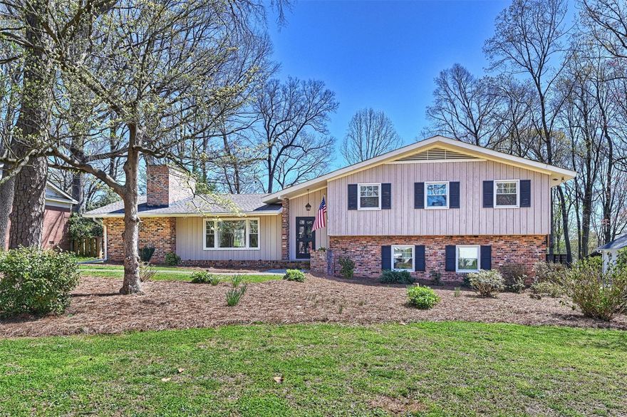 Now is your chance! Beautifully situated on a large level lot, this classic mid-century home with endless possibilities is ready for its next owner! Spacious rooms with newer windows and hardwood flooring throughout, solid doors and heavy molding anchor this home with amazing potential. Eat-in kitchen connects to bright, inviting sunroom with expansive windows overlooking deep, private lot. Plenty of room for a pool, detached garage, & garden! Primary suite and two secondary bedrooms on the upper level with excellent closet space and large baths. 4th bedroom, full bath and laundry on lower level. Huge family room down with bar and built-ins opens to patio great for entertaining. Two outside storage rooms connect to home. Known for its mature trees and wide streets, Lansdowne is minutes to SouthPark & Cotswold with an easy commute Uptown. Excellent public and private schools. Walk to the new Lansdowne Elementary or Providence Day! Bring your imagination and make this one your very own!