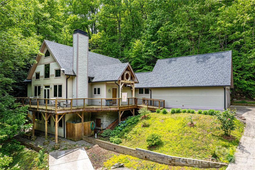 Opportunity knocks! Now priced more than $100,000 below tax value! Gorgeous, immaculate, 4,912 sq ft timberframe home with 1/1 basement apt and year-round mountain views in prestigious Laurel Ridge offers incredible value for the money! Great for multigenerational living or a 2-unit rental for the savvy investor. The 2,161 sq ft main level's sunny living room has a heat-producing fireplace, adjoining deck, vaulted ceiling, and multiple windows bringing the outdoors inside. Kitchen offers hickory cabinets, walk-in pantry, island with a Zodiac heat-resistant quartz countertop, adjacent screened room, and space for a formal dining set. The ensuite primary bedroom on the main level has its own bath and walk-in closet. On the other side of the main level is another full bath, laundry room, 2-car garage with workshop space, and a family room over the garage. The 1,333 sq ft upper floor has another ensuite bedroom/bath and loft that overlooks the living room and outside. The 1.26-acre lot backs up to 200 acres of conservancy land. Abundant storage and generator, too! See this lovely, meticulously cared for home today!