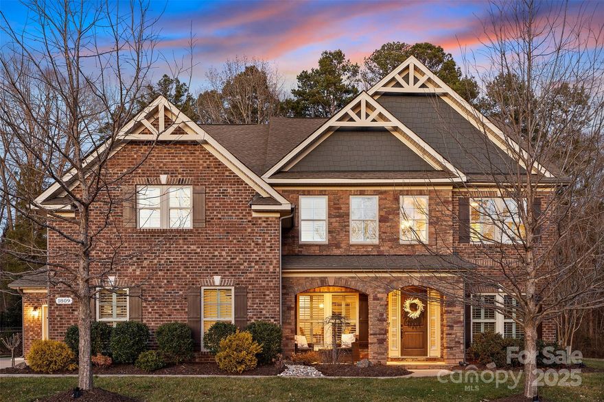 Welcome to 1809 Cavaillon Dr, a stunning full brick 5-bedroom, 4-bathroom home spanning 4,474 sq. ft., this home offers a perfect blend of elegance, modern convenience, and functional design. Inside, the chef’s kitchen is a dream, featuring a pot filler, drawer microwave, high-end appliances, and a large island—ideal for entertaining and everyday cooking. The open floor plan flows into the main living areas, offering gorgeous views of the backyard. Step outside to your private retreat, where a resort-style pool is surrounded by stunning travertine tile, creating a luxurious and inviting space. The outdoor kitchen and fire pit make this the ultimate place for entertaining, grilling, or simply unwinding. Upstairs, a huge bonus room serves as a perfect second living space or media room—offering endless possibilities to fit your lifestyle. This home is just minutes from top-rated schools, charming downtown Waxhaw, shopping, and dining.