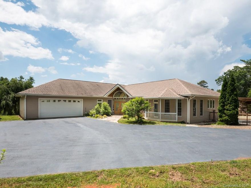 WOW! If you are looking for mountain views, pastures with horses and a beautiful swimming pool just steps away along a wraparound deck, WELCOME HOME! Open floor plan with sweeping VIEWS and plenty of light. This home was custom built and is handicap accessible, inside and out, including the pool. Oversized two car garage with plenty of additional storage and large paved driveway and turnaround. Well planned and maintained landscaping. Close-in to Weaverville and only 20 minutes from Asheville.