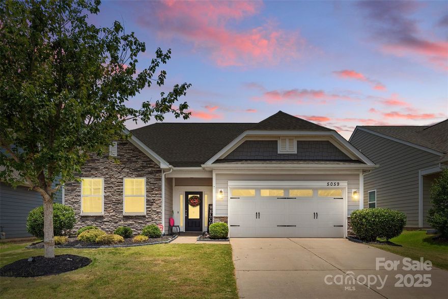 Welcome to your dream home in the amenity-rich Walnut Creek community—This 3-bedroom, 3-full bath gem offers flexible living spaces with an open-concept living room anchored by a cozy gas log fireplace, perfect for relaxing or entertaining around the kitchen island. And there is a separate dining room, or office space-your choice! The primary suite on the main floor provides a private retreat with plenty of space and comfort. There is an additional large secondary bedroom and full bath. The main floor laundry room and 2-car garage add convenience. Upstairs is a large bonus/flex room with a separate, private bedroom and ensuite bath—perfect for multi-generational living or visiting guests. Outside, enjoy the peaceful covered back patio overlooking a private, fenced backyard. Located in the sought-after Indian Land school district and just moments from trails, parks, and pools, restaurants and shopping this home truly has it all.