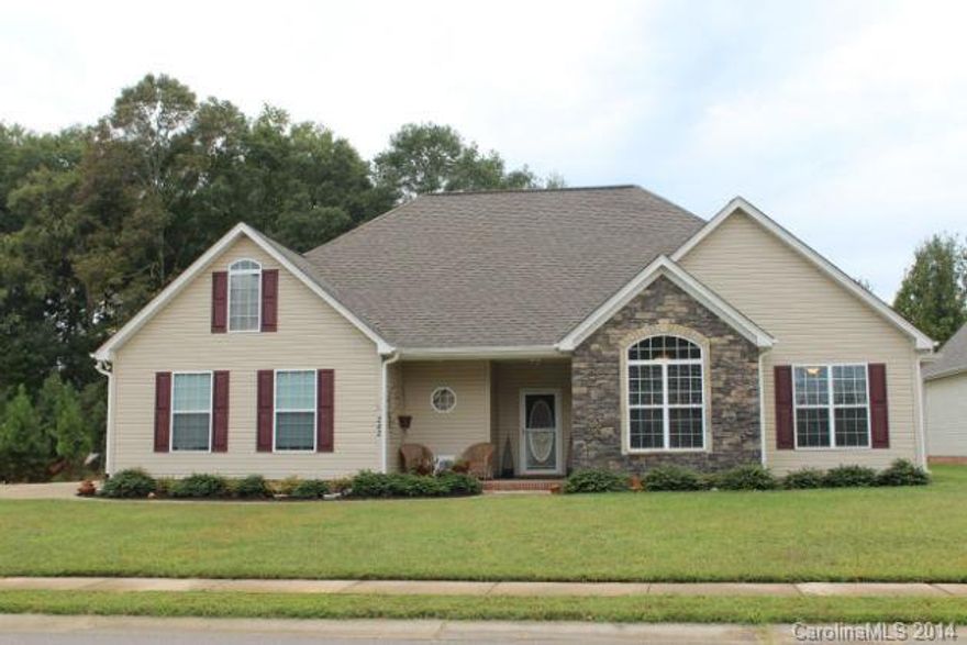 Gorgeous ranch home on a beautifully landscaped .35 acre lot.  Great floor plan with upstairs guest suite! Kitchen has granite, tile backsplash, pendant lights, and double oven. Home has gas logs, formal DR, and large foyer.  Home has lots of storage with a walk-in attic and a 20X24 wired workshop. Extra paved pad with 30amp electric plug.  Great for RV parking! Low HOA dues!