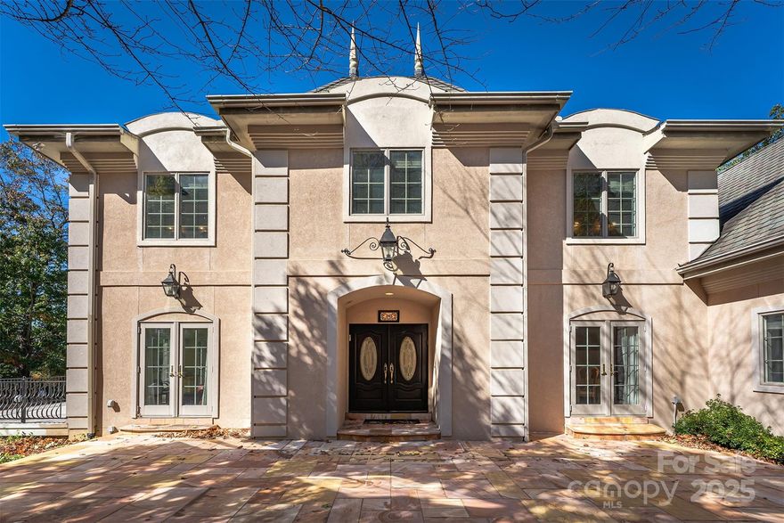 French Chateau in the Mountains!!! This exceptional home offers breathtaking panoramic views of Lake Lure and the surrounding mountains. Perched on the hill at the end of a cul-de-sac, this one-of-a-kind property offers privacy and elegance both inside and out. Attention to detail with high quality building materials such as Anderson Windows, extensive custom outdoor lighting, and a Rumford Fireplace and Chimney Top. You will be amazed by the Aladdin Chandelier that welcomes you as you enter the foyer area. Enjoy the upscale kitchen with Schuller Birds Eye Maple Cabinets, Wolf appliances, warming drawer, Grohe Pot Filler, Kitchen Aid Refrigerator and Double Dishwasher. The home mixes an exquisite blend of period charm and modern comfort like the Bar with ice maker, wine cooler, and with Volcano Onyx back wall.  A beautiful stone fireplace creates a welcoming ambience with an open and bright living area to enjoy the mountain and lake views.  Custom Master Bathroom with Jacuzzi tub with Green Onyx deck. Custom Shower with jets. Marble floor and walls up to ceiling with Green Onyx inserts. Tennessee Flagstone front patio. Most of the main living area is solid oak flooring. Decks and Veranda to enjoy the views. The lower level boasts a finished area perfect as a guest space or game room area.  The huge 1,100+ sq ft garage doubles as a workshop area and a parking location that easily holds four vehicles.  This is a one-of-a-kind home in the mountains with the added amenities of Rumbling Bald on Lake Lure including two championship Golf Courses, three Restaurants, a Private Beach, Wellness Center, and much, much more.  High Speed Fiber Optic Internet available along with underground utilities.