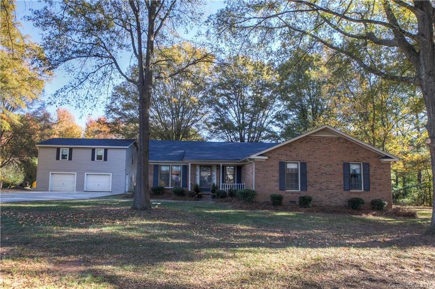 Sitting on 2.36 acres, this 3 br/2ba ranch is a RARE find in Ft Mill. This gorgeous property backs up to a pond and is located in the award winning Fort Mill School District. Perfectly situated in the Carowood subdivision, this home is 2 miles from I-77 and minutes from shopping. The HUGE 24'x32' detached 2 car garage is an ideal space for a workshop and has 791 sq ft of unheated living space on the 2nd floor. No HOA. Home is being sold As-Is and has been priced accordingly.