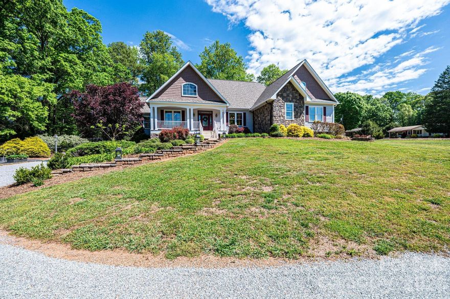 BEAUTIFUL 3,458 sf single level home with walk out basement situated on 2.12 acres, perfect for entertaining.  Features an open floor plan, wood and tile floors throughout and two gas fireplaces.
Large primary bedroom with enough room to create your own private retreat.  Gorgeous views out the french doors that lead to its own balcony.  Additional rooms include two bedrooms, a custom wood panel library/office, formal dining room, laundry room and large sitting room.
Spacious Island kitchen with granite countertops, new stainless-steel appliances and large walk-in pantry. Oversized two car garage with outside RV parking and 50 amp outlet. Garage has access to attic, which provides ample space for additional storage. The home provides a peaceful rural retreat just moments from downtown Catawba restaurants and entertainment and short drive to the city conveniences of Hickory and Statesville.   Recent roof and exterior paint, fenced back yard.