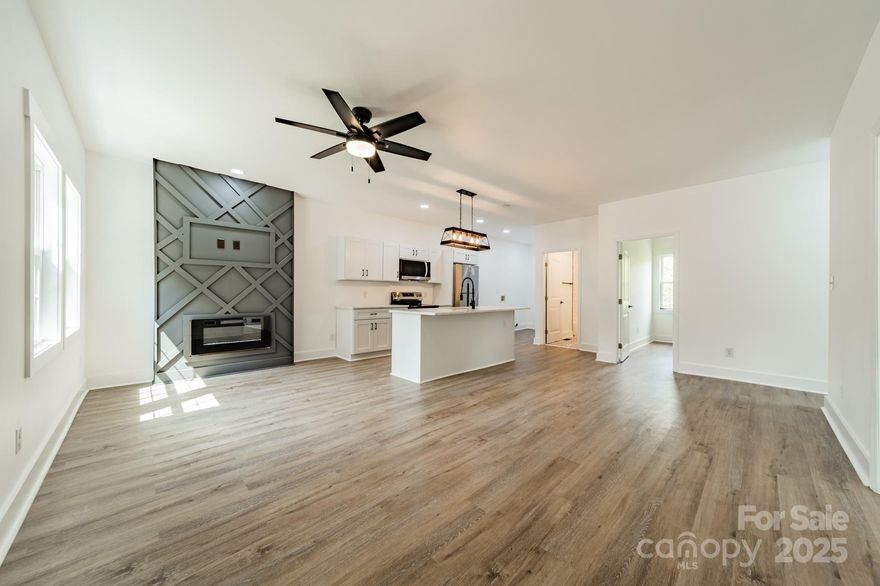 Prime Investment Opportunity in a Rapidly Growing Area!
Discover this beautifully renovated 3-bedroom, 2-bath home located just steps from the heart of Downtown Gastonia—an area undergoing exciting transformation and revitalization. With new developments, restaurants, and entertainment venues emerging all around, this property offers not just a home, but a chance to invest in a booming neighborhood with strong potential for fast equity growth.

Fully updated with 9FT ceilings, brand-new roof, HVAC, vinyl siding, windows, and luxury vinyl plank flooring throughout. The open-concept living area centers around a cozy fireplace, while the kitchen is outfitted with quartz countertops, high-end appliances, and modern finishes. Seller also including Washer & Dryer.

Located within walking distance to the FUSE District Stadium, Little Theatre of Gastonia, the Gastonia Recreation Center, and the expanding downtown scene—this is your chance to get in early on a neighborhood on the rise.