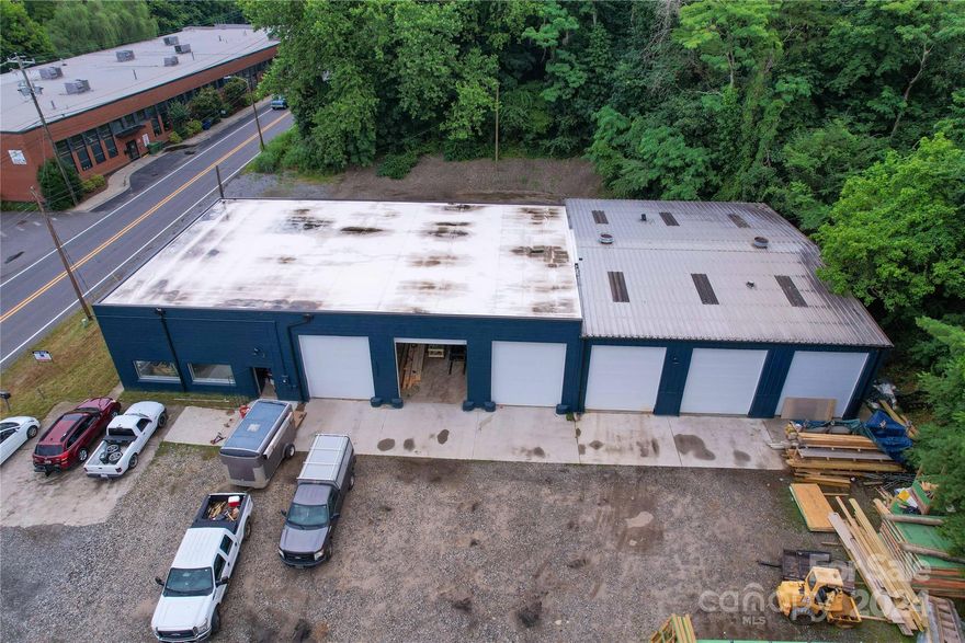 Renovated building ready for a new owner.  Newly painted exterior with office area and 6 large drive-in doors.  Laydown area on both sides of the building.  Located directly on Sweeten Creek Rd.  Ample parking.  A must see building.