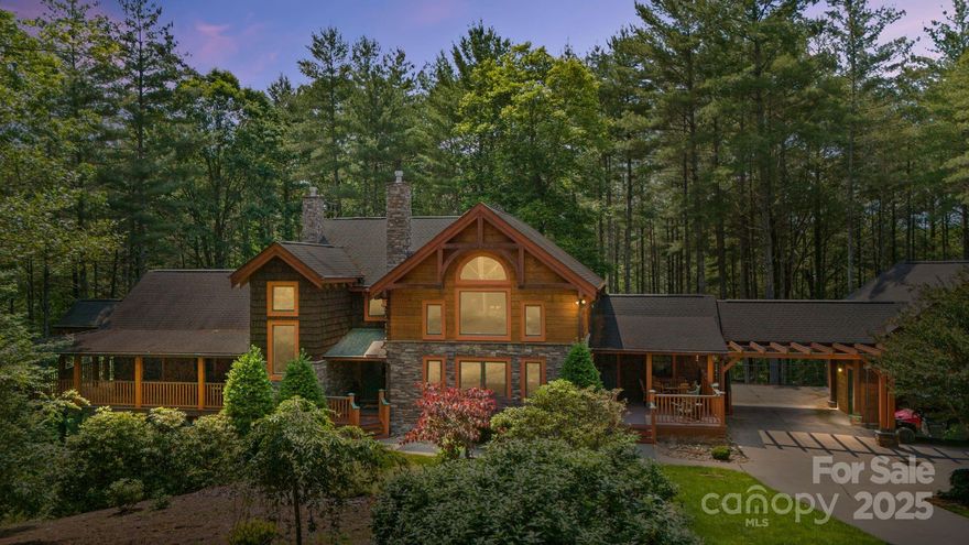 Tucked away in an exclusive gated community within the breathtaking Blue Ridge Mountains, this exceptional property offers the perfect balance of privacy, luxury, & natural beauty. Set on 4.8 +/- wooded acres, this mtn retreat invites you to live among the trees w/ private trails winding through your own backyard oasis. Spanning approx. 3,500 sq.ft, the main residence boasts an open floor plan, soaring cathedral ceilings & expansive windows flood the living area w/ natural light, while a floor-to-ceiling stone fireplace serves as a stunning focal point. The chef’s kitchen fts high-end appliances & a walk-in pantry. The primary suite fts. its own fireplace. With pprox. 1,450 sq.ft. the finished basement space complete w/full bathroom ideal for a recreation room/home theater/etc. For extended family/guests an apt above the detached garage includes full bath & private entrance. This stunning home in the Pisgah National Forest delivers the best of mtn living in a sought-after community.