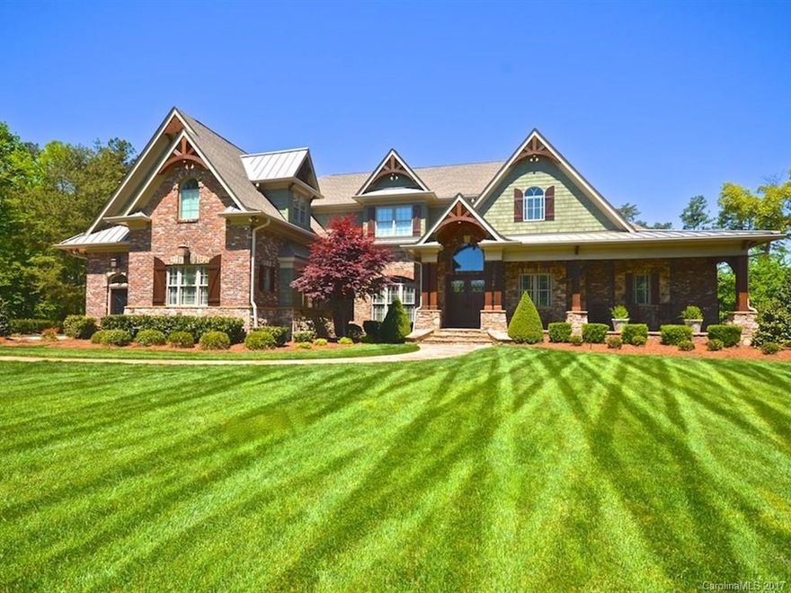 Traditional Craftsman exterior with reclaimed brick, hand honed stone & Cedar Shake. Exceptional craftsmanship with an artful combination of Craftsman and Traditional styles.  Extensive wood work and moldings. Custom Eudy's Cabinets & Built-ins. Custom crafted ceilings. Custom milled 7inch white oak floors. PRIVATE, Huge 1.45 acre waterfront/golf course. Extensive outdoor living, 3 screened porches, 2 outdoor FP, built-in grill,terrace, custom pool & spa. Boat slip L-18 Included. Your own Oasis!