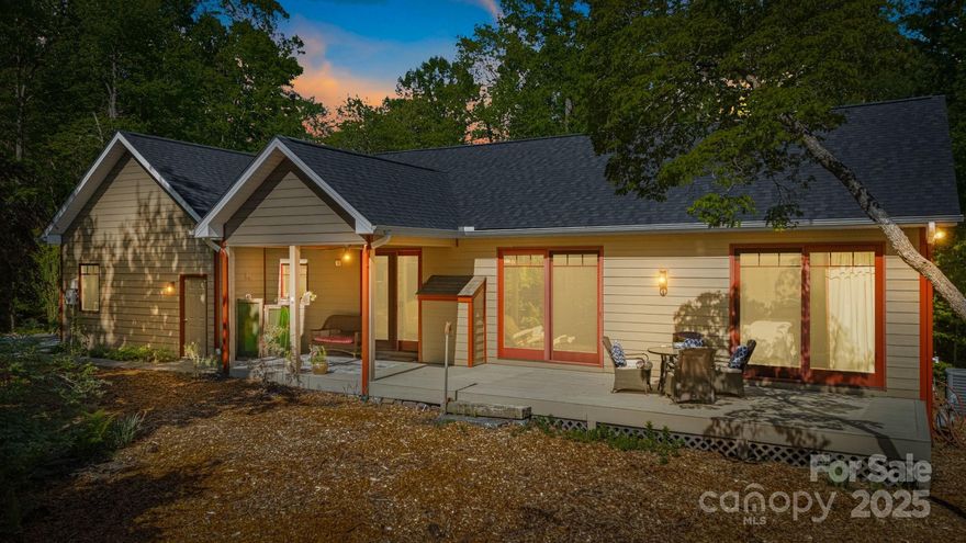 Seller offering a 2-10 Home Warranty at closing! Tucked in the trees of desirable Laurel Park, this 3BR/2BA home offers a peaceful setting just minutes from downtown Hendersonville. Inside, you’ll find vaulted ceilings, hardwood floors, and abundant natural light. The open living area features a stone fireplace and sliding doors that lead to a private deck—ideal for relaxing or entertaining. The kitchen boasts granite counters, stainless appliances, and ample cabinetry. The spacious primary suite includes a walk-in closet and a bath with a soaking tub and wooded views. Covered front and back porches add inviting outdoor living space, while mature landscaping enhances the tranquil feel. Whether you’re looking for a year-round home or a mountain getaway, 411 Alta Circle delivers comfort, style, and a natural connection to its beautiful surroundings.