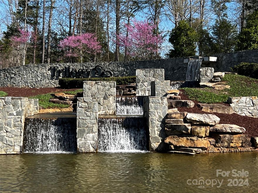 Welcome to Lake Norman's premiere 55+ community for adults seeking a life style of comfort, luxury and tranquility. This beautiful 2 Bedroom, 2 Bath home with open floor plan and 9 ft. ceilings that offers Smart Home Technology, a large kitchen with expansive granite island, ample soft close cabinets, SS appliances, LVP Flooring and so much more. Retreat to your expansive primary bedroom with recessed lighting, walk in closet and walk in shower. The generous sized flex room is perfect for an office, music room, reading room or quiet retreat. Enjoy carpentry and wood working? Your garage offers additional space for a work bench or project area. Relax on your screened in porch and outdoor custom made patio with surround sound for outdoor entertainment.  This home is upgraded with gas fireplace, sensor lights in laundry room and primary closet, recessed lighting Primary Bedroom and Flex Room. Upgraded light fixtures and ceiling fans along with gas connection for your outdoor gas grill.