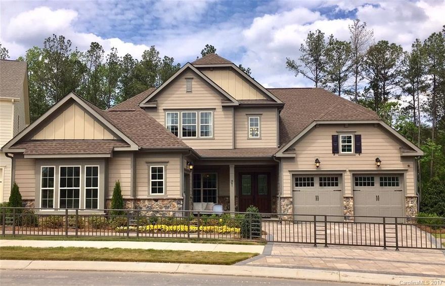 This beautiful model home is located on a private wooded home site with spacious outdoor living area complete with fireplace, grill and skylights. The popular Bexford plan features owners AND guest suite on the main floor. First floor laundry, great room with vaulted ceiling, brick fireplace and built-ins and butler's pantry in dining area.  Second level features 2 bedrooms with hall bath, loft and large finished bonus room.