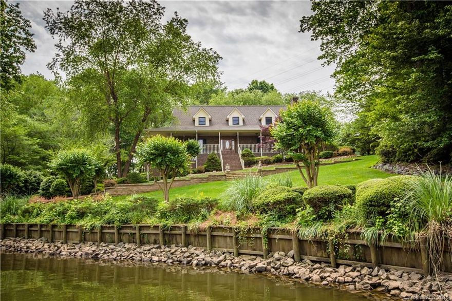 Custom lakefront home w/boathouse! Wrap around porch, 840 sq ft garage heated/cooled under the home, 408 sq foot of storage surrounding the garage! Elevator access from garage level to main as well as inside stair access. Large rooms, beautiful views and concrete drive leads from Mt Gallant right to your garage! Lush landscape, large kitchen w/stainless & black appliances, over sized master with water view - this home is a hidden gem!  View the online walking tour for more details! Welcome home!