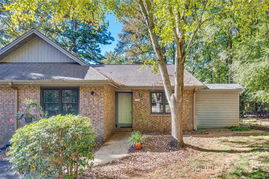 Discover this end-unit condo featuring 2 bedrooms and 1 bath. This home offers a spacious foyer and dining area, large family room with wood floors. Kitchen has ample cabinetry and includes stainless steel appliances.Enjoy your meals in the dining area, breakfast nook, or on the oversized private deck, perfect for relaxing while overlooking the wooded view.

The laundry room is equipped with a washer, dryer, and plenty of cabinets for storage. The over-sized bathroom provides generous counter space and a large walk-in shower with a bench seat. With HOA fees covering trash, exterior maintenance, and lawn care, maintenance-free living is at your fingertips. Ideally situated near I-77, Charlotte Douglas Airport, Carowinds, shopping, and dining, this condo is a must-see!