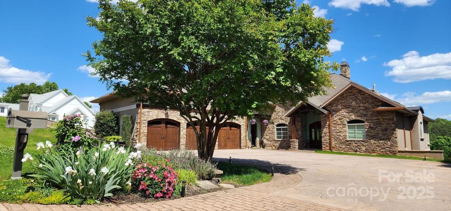 Discover the pinnacle of lakefront luxury with this stunning 4-bedroom, 4 full and 3 half bath estate, offering the ultimate blend of comfort, style & serenity.  This home provides three unique spaces ideal for family gatherings or extended stays, each filled with natural light and featuring beautiful flooring throughout.  The expansive kitchen is a chef’s dream, boasting premium appliances & stylish finishes. Each of the 4 bedrooms features its own private ensuite, primary bath boasts heated flooring, steam shower, whirlpool tub & dream closet. Bonus/bedroom offers kitchenette and W/D hookup, Lavish features include 10+ ft ceilings, multi piece moldings, 4 FPs, Central vac, tankless hot water, custom built ins, quartz counter tops, W/D on all levels & Huge walk in attic, Outside is perfect for entertaining, enjoy the swim spa, boat dock w/ lift & Sea Doo ramps & triple garage with 240v EV charge port. Located on the main channel this property offers unobstructed breathtaking views.