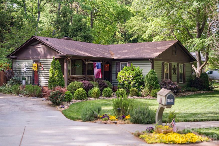 There are homes that check boxes. Then there are homes that stop you.
6129 Old Meadow Drive is the second kind. Tucked behind mature trees on a generous homesite, this ranch-style property has been loved into something rare, a private outdoor sanctuary that takes years to build and cannot be replicated on a standard lot.
Step into the backyard and the pace of everything changes. A handcrafted waterfall koi pond flows through lush, professionally landscaped grounds with full irrigation and landscape lighting that makes the property as beautiful at night as it is at day. The above-ground pool with its own deck and pergola is where weekends are meant to be spent. A firepit for cooler evenings. A storage shed tucked neatly into the greenery. And a detached two-car garage that functions as additional storage, a workshop, or the ultimate flex space.
Inside, the home has been thoughtfully updated without losing its warmth. New floors throughout the main living areas. An updated kitchen with new appliances, quartz countertops, white raised-panel cabinetry with matte black hardware, and a farmhouse sink framed by a window that looks out to the trees. The primary bath has been refreshed with granite counters and a custom-tiled walk-in shower featuring dual showerheads, penny tile flooring, and built-in niches. The living room anchors the home with a brick fireplace, the kind you actually use on a Sunday morning when the house is quiet.
Crown molding, wainscoting, and decorative columns add architectural character that speaks to a different era of craftsmanship. A whole-house fan keeps energy costs in check. The fenced yard offers complete privacy. The location delivers convenience to shopping, dining, and major corridors without sacrificing the tranquility that makes this property feel like its own world.
The updates are done. The landscaping is mature. The pond is running. All that's left is making it yours.