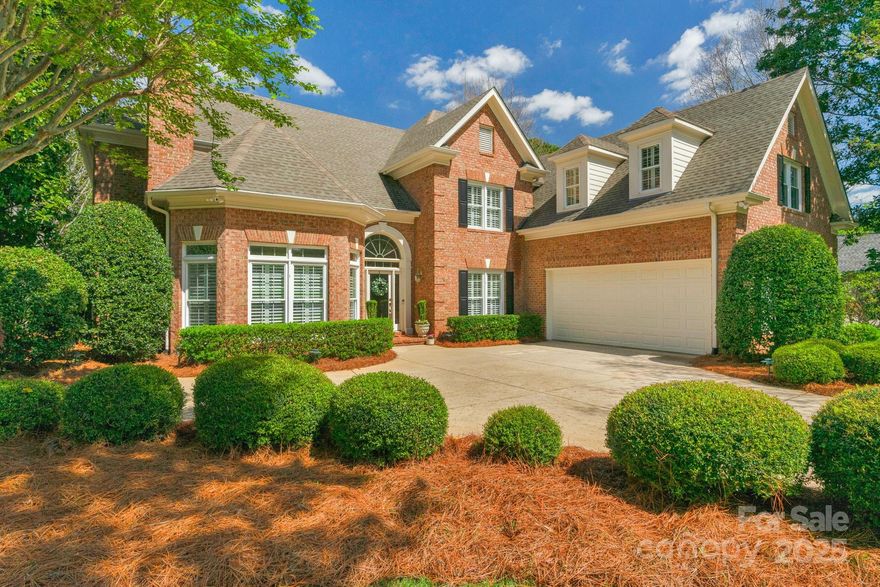 Stunning full-brick estate overlooking Ballantyne Country Club’s pristine 6th hole! This elegant home welcomes you with a 2 story great room, accented by architectural windows, plantation shutters, hardwood floors and gas fireplace. Kitchen includes double oven, dishwasher, island with cooktop, pantry, and spacious breakfast bar. Keeping room with windows on 3 sides provide golf course views. Entertain in the main level office with fireplace and formal dining room. Luxurious main-level primary suite features oversized closets and spa-like bath. Upstairs, find 3 additional bedroom suites plus large bonus room, accessible by dual staircases. Step onto the picturesque brick patio perfect for entertaining. Rear yard surrounded by lush greenery, mature trees, and captivating water feature. 2.5-car garage with epoxy floors great for golf cart or additional storage. Convenient access to the Ballantyne Bowl, Ballantyne Corporate Park and CLT airport.
