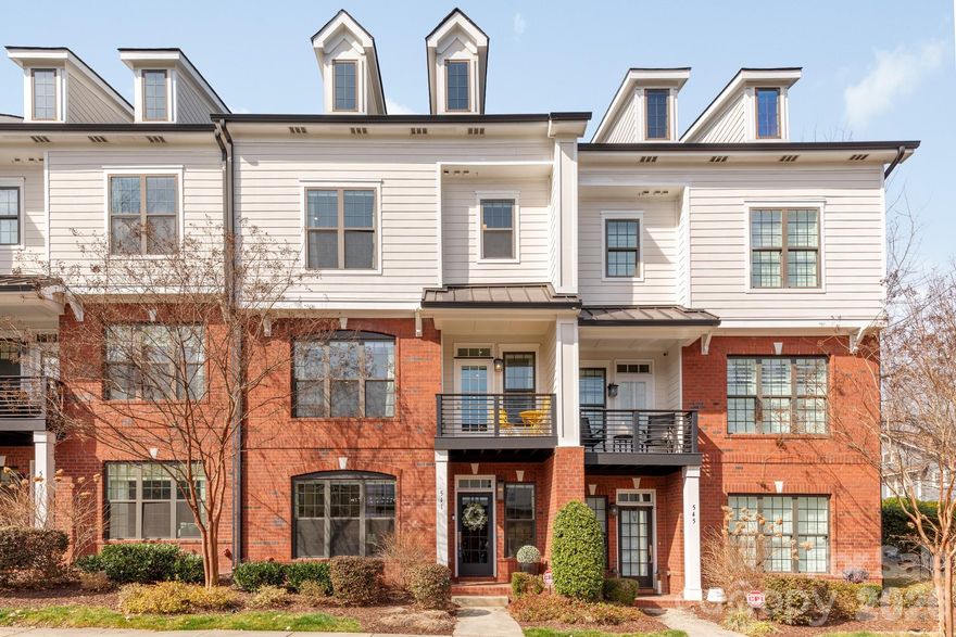 Is there a refined three-bedroom townhouse in Davidson that pairs architectural detail with modern ease, moments from the heart of town? 541 Griffith Village Lane offers 2,840 square feet across three impeccably finished levels, built in 2019 and thoughtfully designed for elevated living.

Rich wood floors and a sleek linear gas fireplace anchor the open-concept main level, where a curated kitchen with island seating, gas cooktop, convection oven, wine and beverage refrigeration, and custom built-ins elevates both daily living and entertaining. Upstairs, the primary suite with walk-in closet and en suite bath is joined by two additional bedrooms and a full bath.

The finished walk-out level presents a versatile lounge, office, or fitness studio with full bath and storage. Outdoors, a fenced patio and covered porch offer private retreats, complemented by a detached two-car garage and additional parking. Turnkey, timeless, and distinctly Davidson.