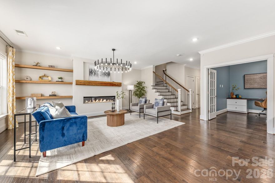 Is there a refined three-bedroom townhouse in Davidson that pairs architectural detail with modern ease, moments from the heart of town? 541 Griffith Village Lane offers 2,840 square feet across three impeccably finished levels, built in 2019 and thoughtfully designed for elevated living.

Rich wood floors and a sleek linear gas fireplace anchor the open-concept main level, where a curated kitchen with island seating, gas cooktop, convection oven, wine and beverage refrigeration, and custom built-ins elevates both daily living and entertaining. Upstairs, the primary suite with walk-in closet and en suite bath is joined by two additional bedrooms and a full bath.

The finished walk-out level presents a versatile lounge, office, or fitness studio with full bath and storage. Outdoors, a fenced patio and covered porch offer private retreats, complemented by a detached two-car garage and additional parking. Turnkey, timeless, and distinctly Davidson.